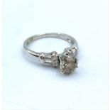 18ct white gold ring with 0.85ct diamond in claw setting with diamond shoulders, weight 2.8g and