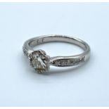 9ct white gold ring with 0.62ct diamond in total, weight 3g and size M
