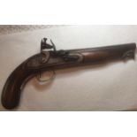 A Flintlock pistol circa 1792-1795 with steel barrel and walnut stock, metal push rod and brass