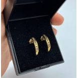 Pair of 9ct yellow gold earrings with 0.3ct diamonds inset, weight 1.6g