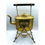 Antique brass kettle on warming stand, some small dents from use.