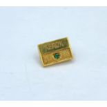 9ct gold Xerox service award badge pin, with emerald inset weight 1.8g