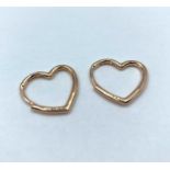 A pair of rose gold heart shaped earrings, weight 2.1g
