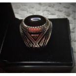 Stone set silver ring with oval jet black stone to centre, silver bead work to shoulders, size O