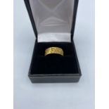 18ct yellow gold band, size L and weight 5.42g approx