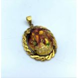 Yellow metal pendant with Limoges multi coloured centre stone, weight 5.9g and 3cm long