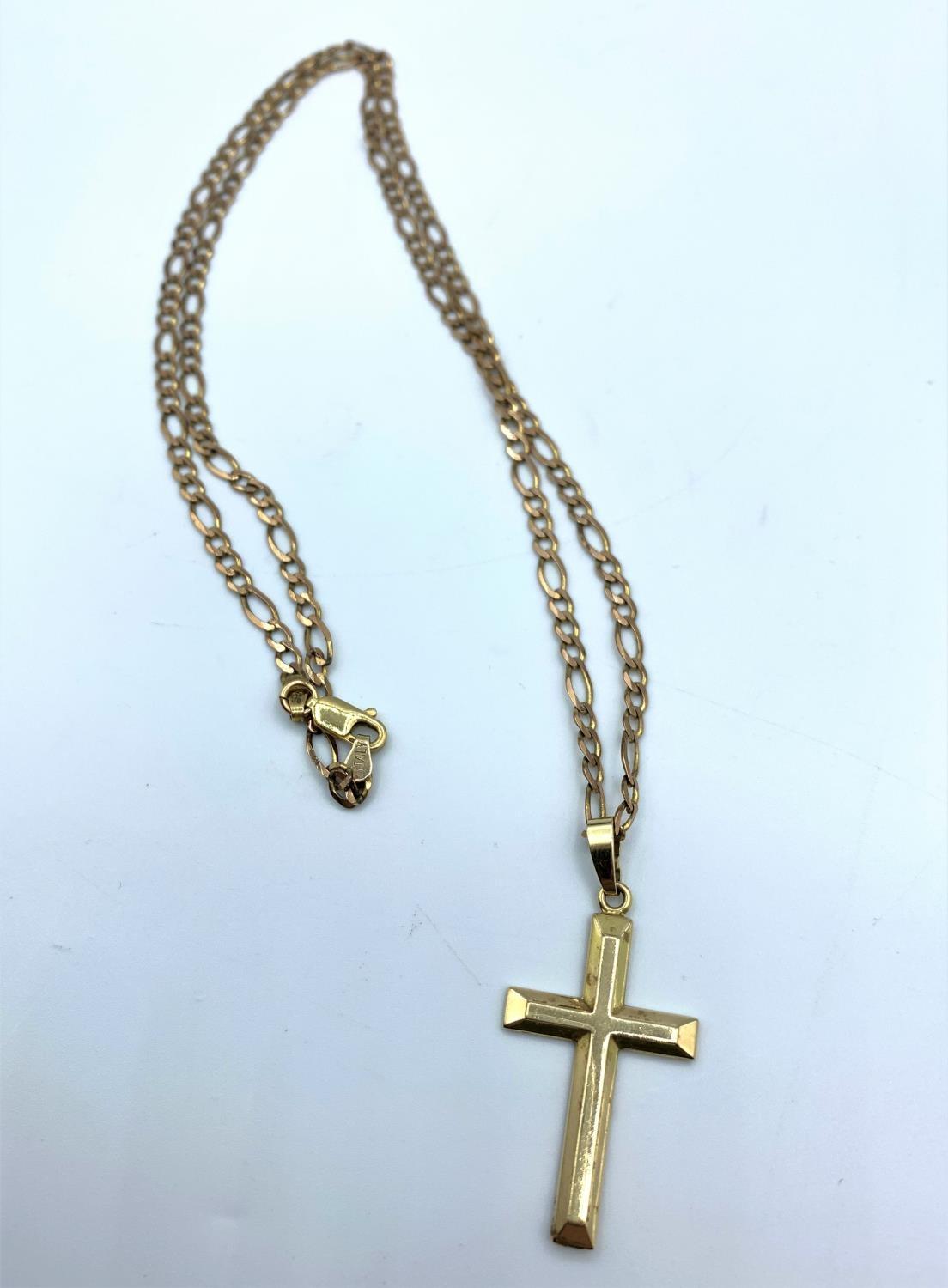 A 9ct yellow gold cross on a 34cm long necklace, weight 8g approx