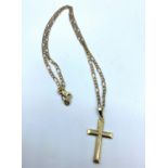 A 9ct yellow gold cross on a 34cm long necklace, weight 8g approx