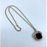 A vintage 15ct rose gold necklace with 9ct pendant, weighing 13g and the length 34cm.