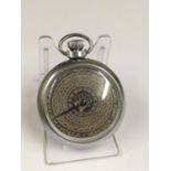 Vintage spinning gaming pocket watch with an astrology design on the face, in working order.