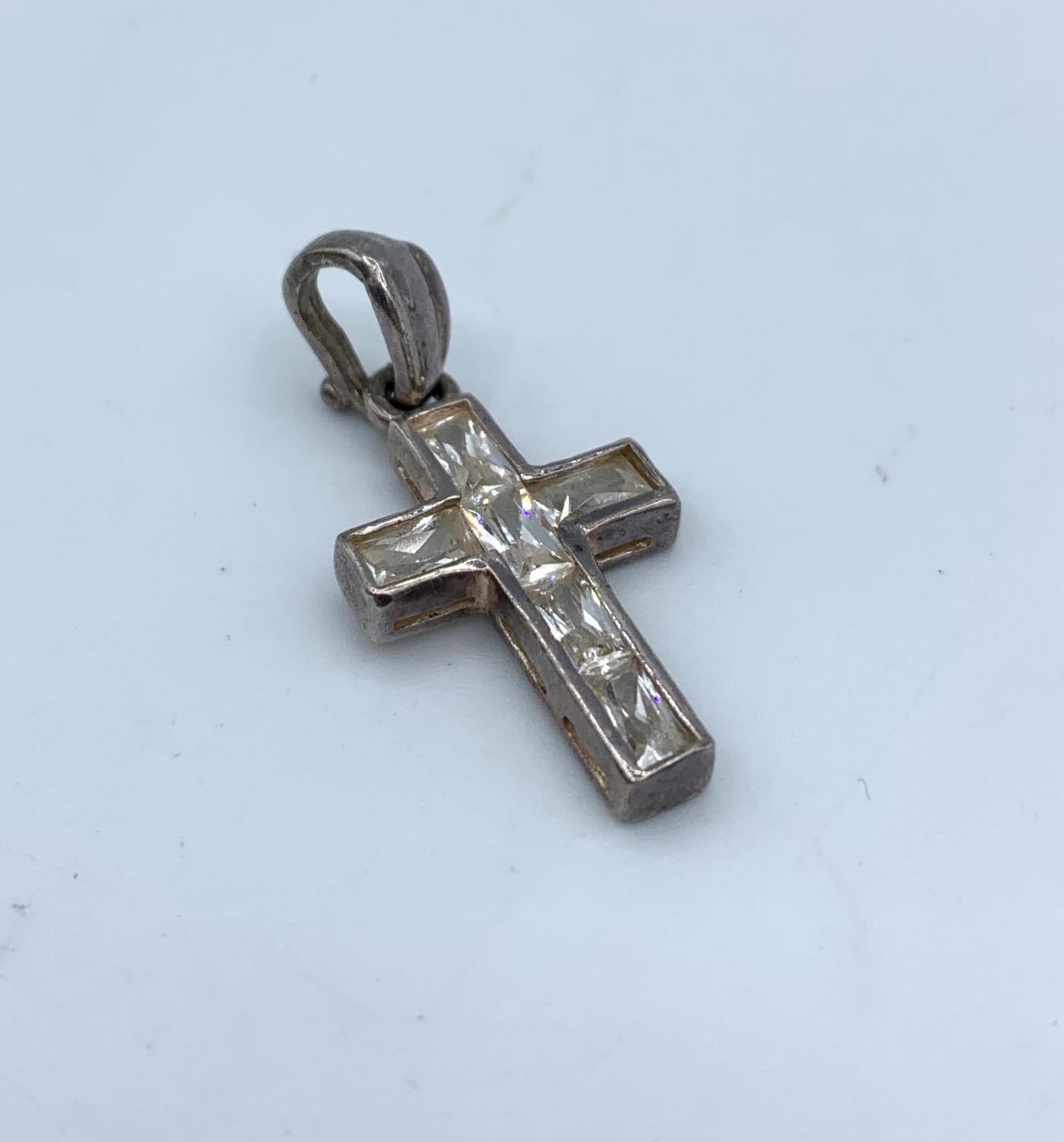 A Silver Cross with C.Z. Centre. 2.9g