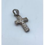 A Silver Cross with C.Z. Centre. 2.9g