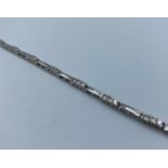 Stone set 9k white gold bracelet in modern design, approx 10cm long and weight 5.6g