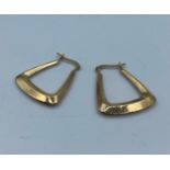 Pair of 9k yellow gold earrings in modern design, weight 1.25g and 3cm long approx