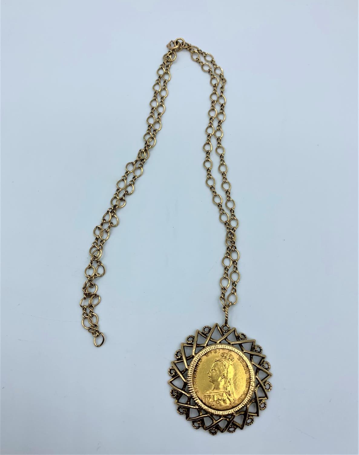 1892 Victoria gold Sovereign set in 9ct with a 33cm chain, total weight 19.6g