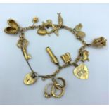 A 9ct yellow gold charm bracelet with 15 interesting charms, weighing 29.9g.
