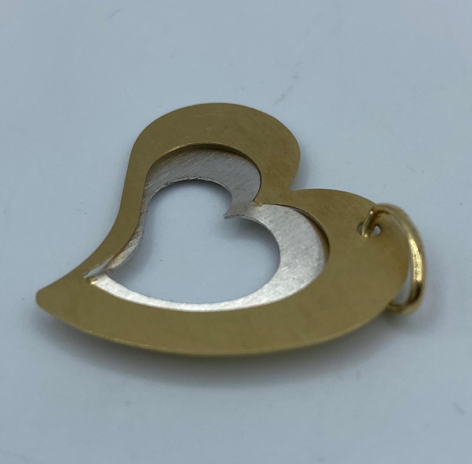 Large heart shaped pendant set in 14k yellow and white gold in modern design, weight 2.24g and - Image 2 of 2