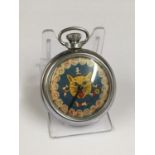 Vintage spinning gaming pocket watch with a cat face design on the face, in working order.