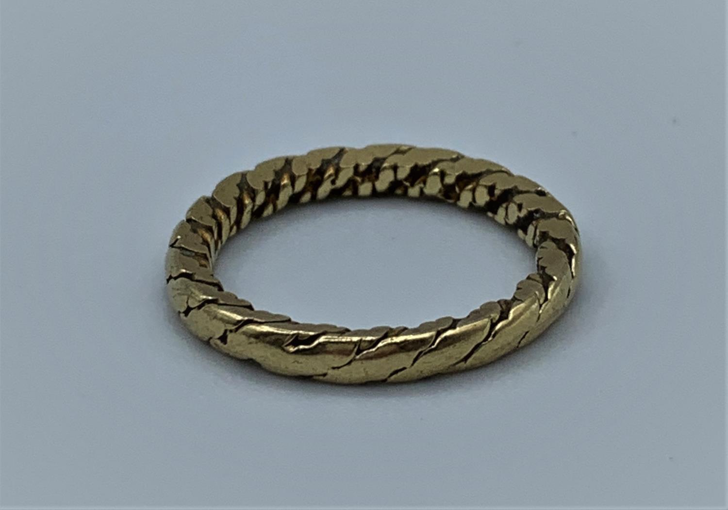 A yellow metal (tested as 9ct) unusual shaped band, weight 2.6g and size K/L - Image 3 of 3