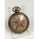 Vintage spinning gaming pocket watch with a red star design on the face, in working order.