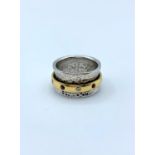 Hand made 18ct white gold shaped band with 18ct yellow gold ring spinner decorated with small