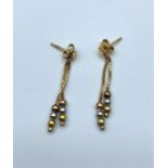 Pair of 9ct rose gold drop earrings with 3 coloured golden balls at the bottom, weight 1.4g approx
