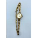 A sovereign ladies Watch in 9ct gold with 9ct gold strap