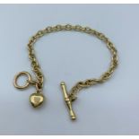 9ct yellow gold bracelet with T bar and small 9ct gold heart, weight 9.6g and 18cm long approx