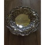 Antique silver bowl with stunning heavily embossed repousse work having scroll and floral design,
