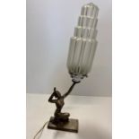 Vintage Art Deco chromed kneeling lady holding amazing 4 tiered skyscraper glass lamp. with power