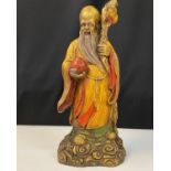 Bronze of an old Chinese Immortal SAU, H35cm x W15cm Sau cups a peach in his hand, a symbol of