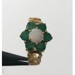 9K yellow gold ring with emeralds and opal, weight 2.9g and size J1/2 (ECN 350)