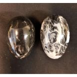 Pair of black marble egg shaped paperweights 12cm x 6cm (2)