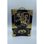 Ornate Oriental lacquered and ebonised jewel box, inset Mother of Pearl, engraved brass escutcheons,