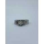 18ct white gold ring with 0.40ct diamond centre and more diamond on the shoulders, size L and weight