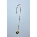 A small gold heart on a 9ct gold 40cm long necklace
