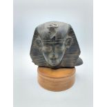 Egyptian stone bust possible reproduction, mounted on turned wooden base.15cm Hx 13cm weight 1.2kg