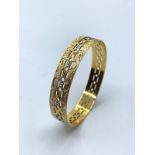 22ct yellow gold bangle 6cm diameter and 18mm band wide, weight 25.4g approx