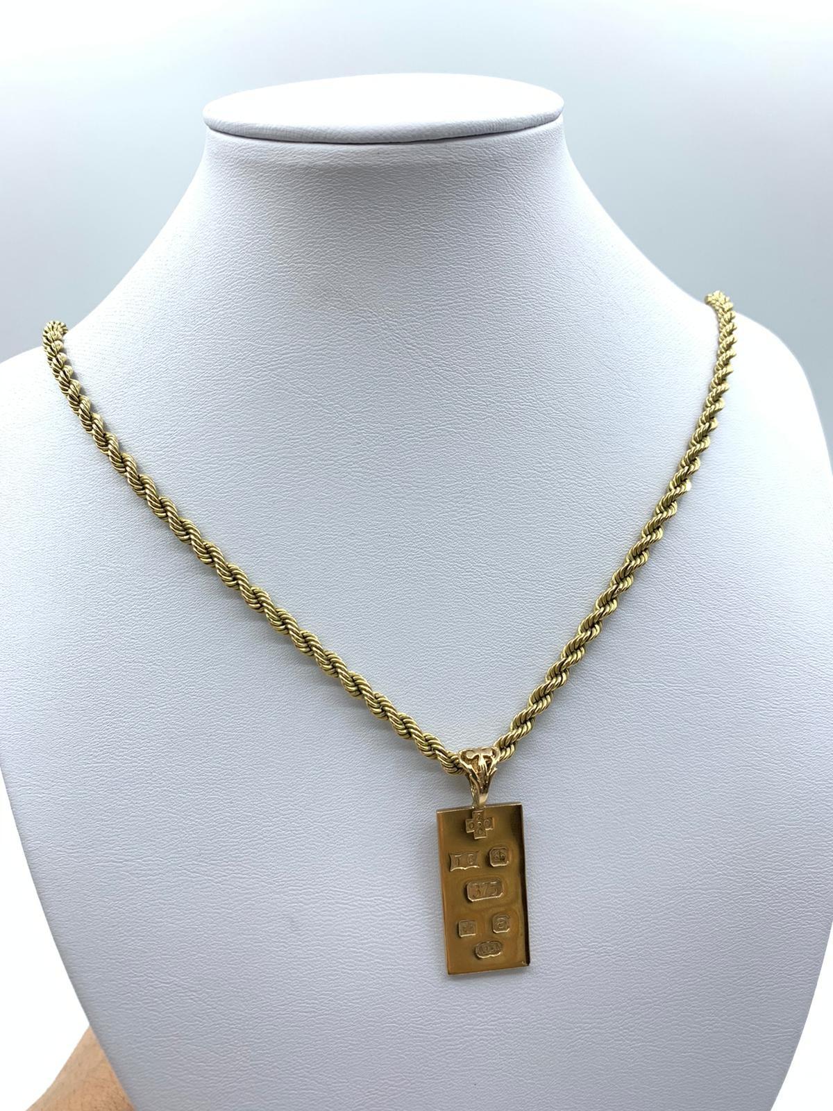 9ct yellow gold ingot pendant with full hallmark on the back, set in 9ct gold chain 70cm long, total
