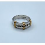 9ct white gold ring trimmed with yellow gold having 7 small diamonds, weight 4.9g and size N/O