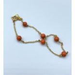 9ct yellow gold and coral bracelet, weight 1.6g and 18cm long