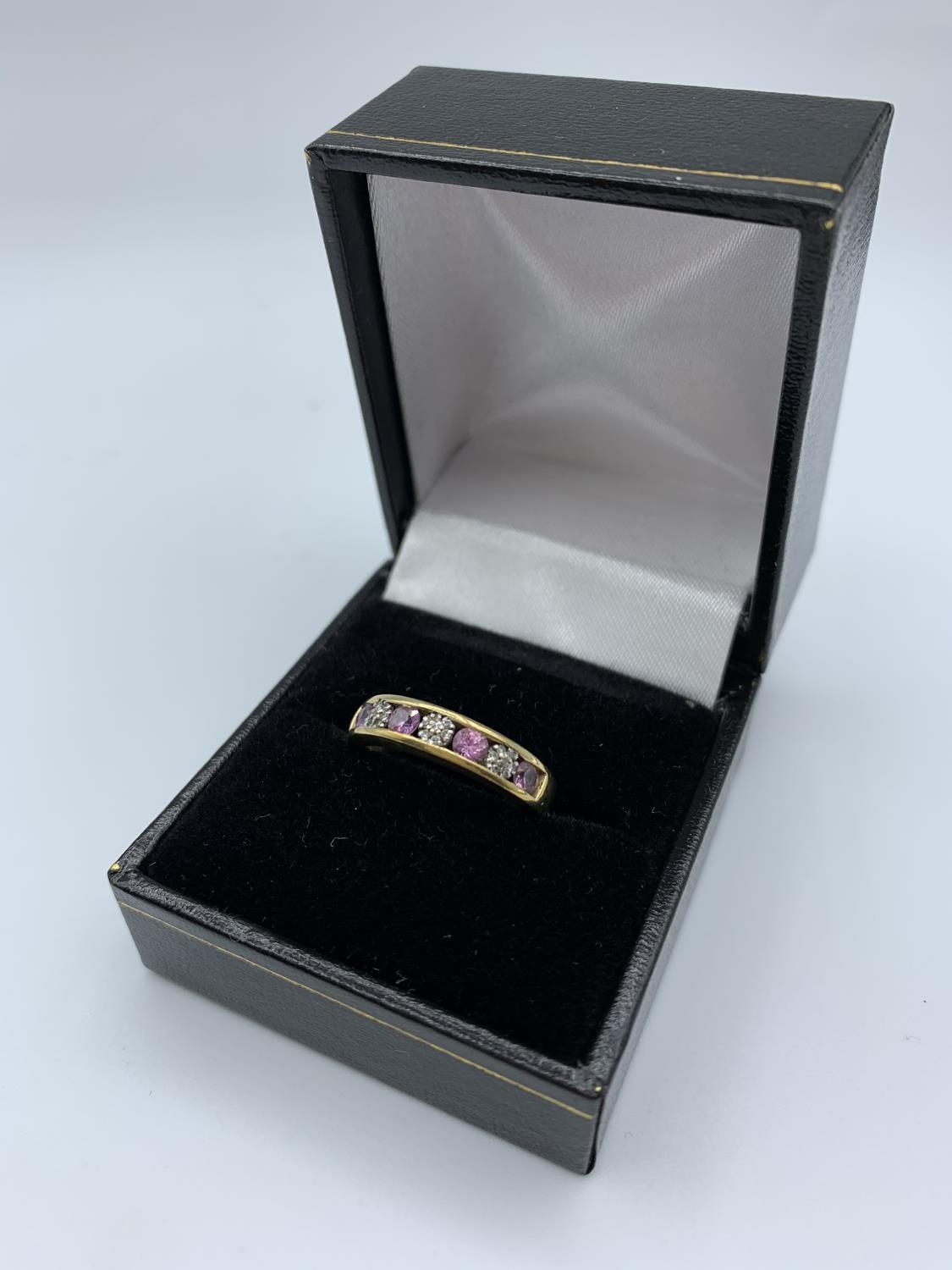 9ct yellow gold ring with pink and white stones, weight 2.4g and size L