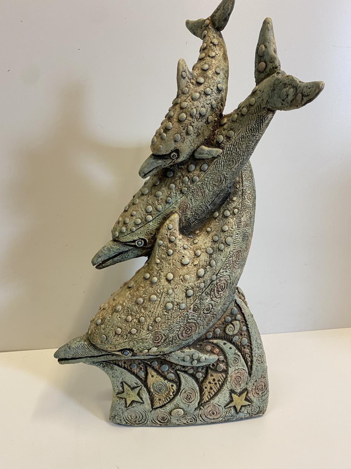 A stylish resin statue of 3 diving dolphins, 40cm tall