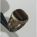 9k yellow gold ring with tiger eye stone (13x 11mm cushion), weight 5.2g and size R1/2 (ECN599)