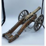 Vintage style Louis XIV brass and timber French cannon mounted on carriage frame. 45cm L x 22cm W