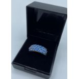Silver Ring stone set with 25 bright Topaz coloured stones, marking inside band for 925 silver and