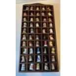 Assortment of 50x Bone China Thimbles presented in a wooden display case, each thimble has a