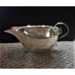 Antique hallmarked Silver Mappin & Webb Sauce Boat, having scroll handle and three cabriole legs,