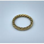 A Woven yellow metal (tested as 9ct) unusual shaped band Ring, weight 2.6g and size K/L