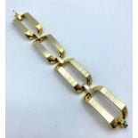 18ct White and Yellow Gold, Designer Bracelet. Weight 66.18g and 18cm long